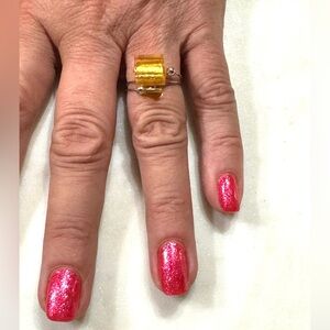 Modern fashion ring - stainless steel with yellow dichroic glass.